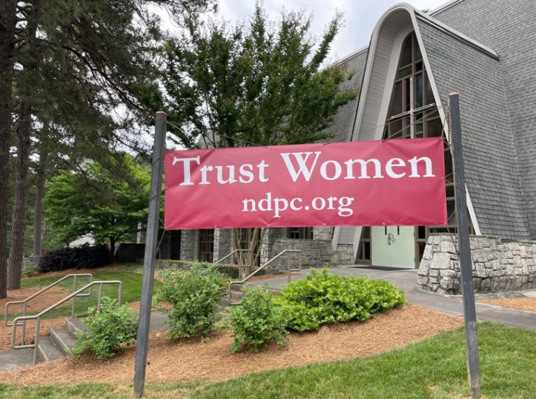 Photo of a Banner that says Trust Women. NDPC.org